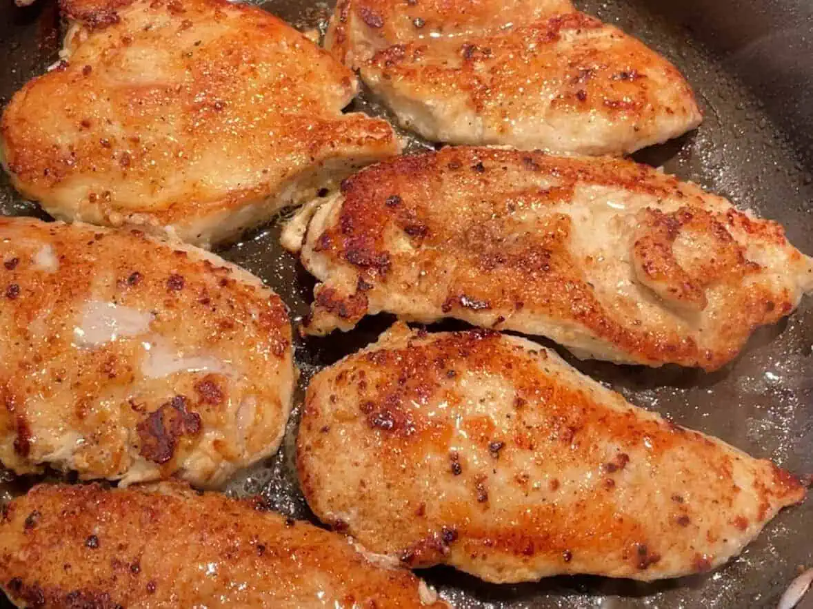 Cook chicken for chicken Alfredo.