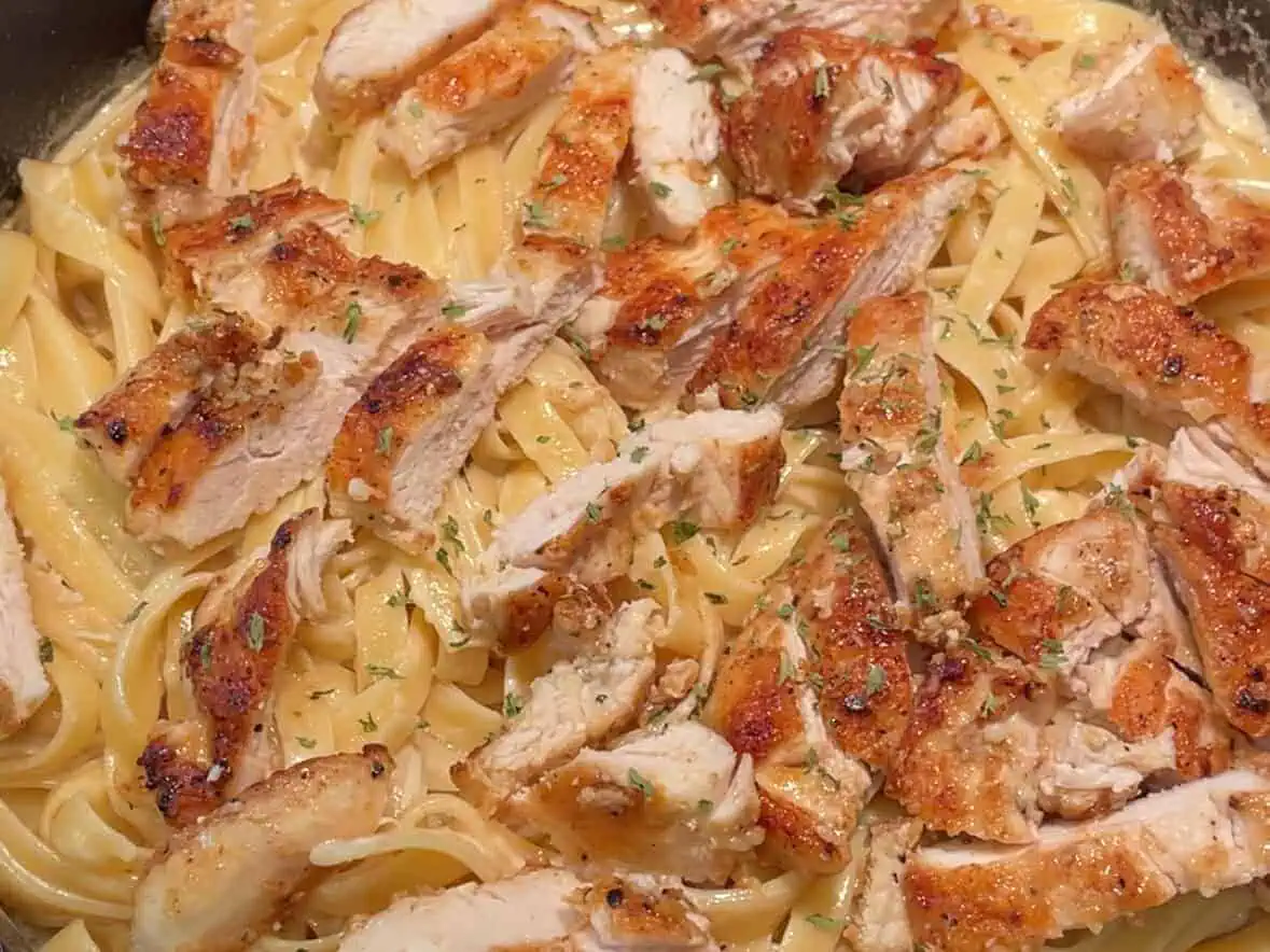 Top the Alfredo with the cooked chicken.