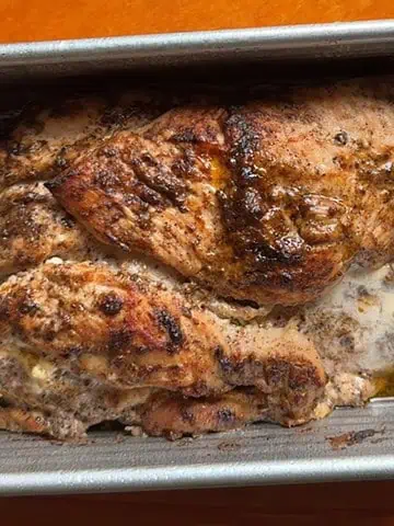 Juicy chicken shawarma baked in a loaf pan with Middle Eastern spices, ready for slicing