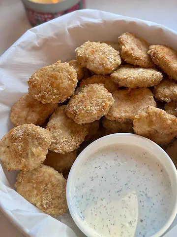 Homemade baked chicken nuggets served with homemade ranch dressing.