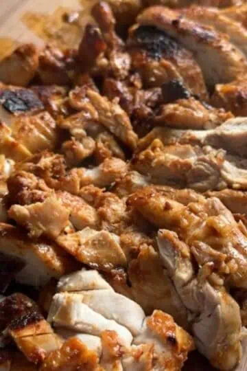 Crispy and juicy sliced chicken thighs cooked in cast iron, ready to serve