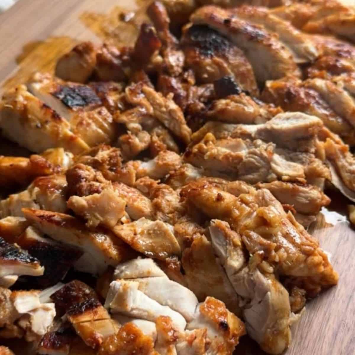 Crispy and juicy sliced chicken thighs cooked in cast iron, ready to serve