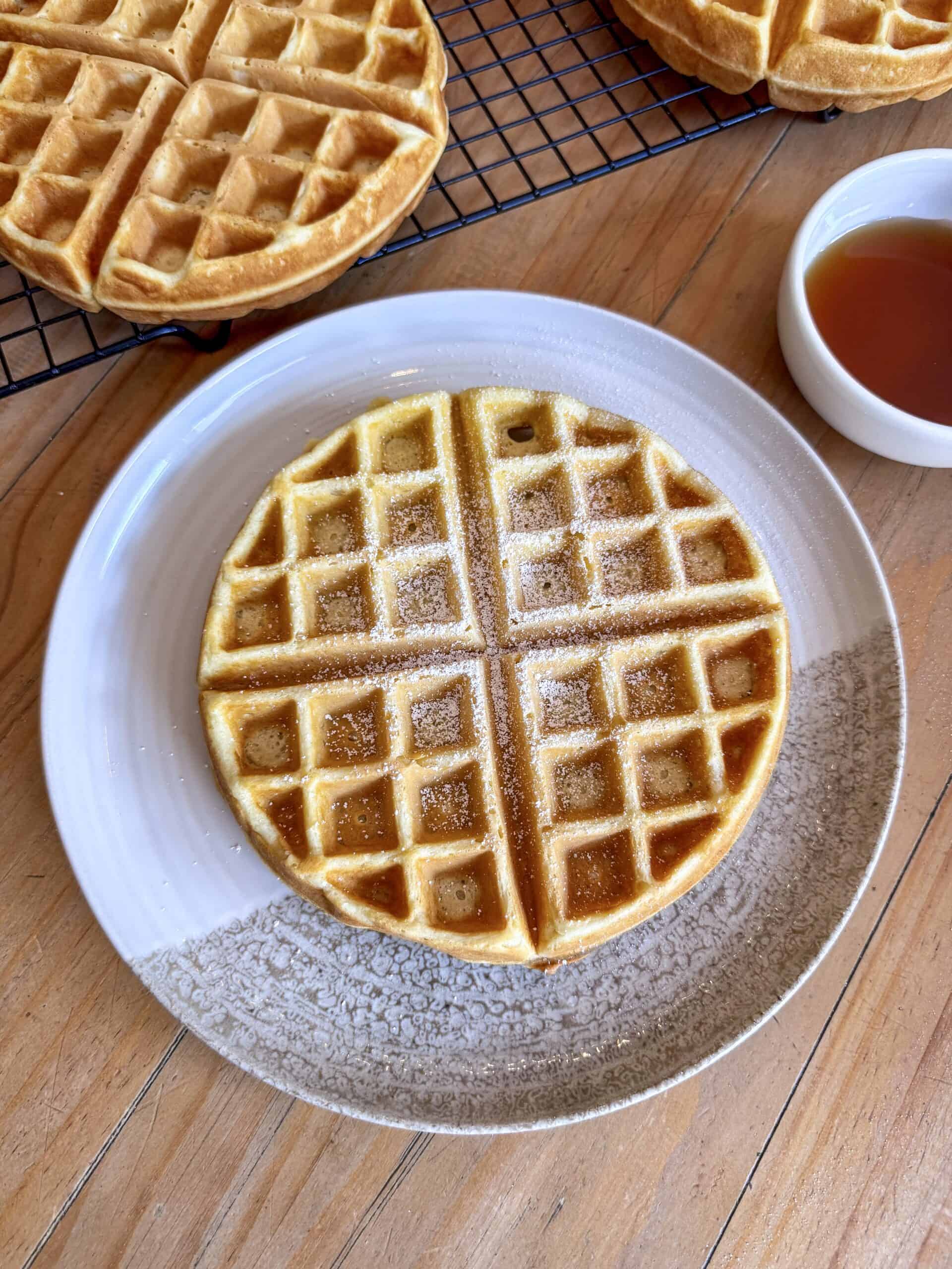 Close-up of fluffy buttermilk waffles with golden crisp texture