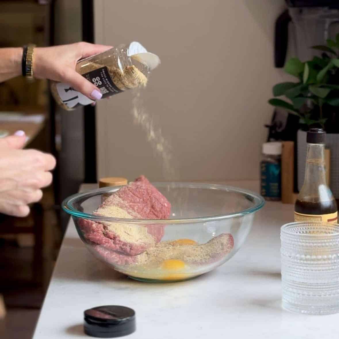 Seasoned ground beef in a mixing bowl