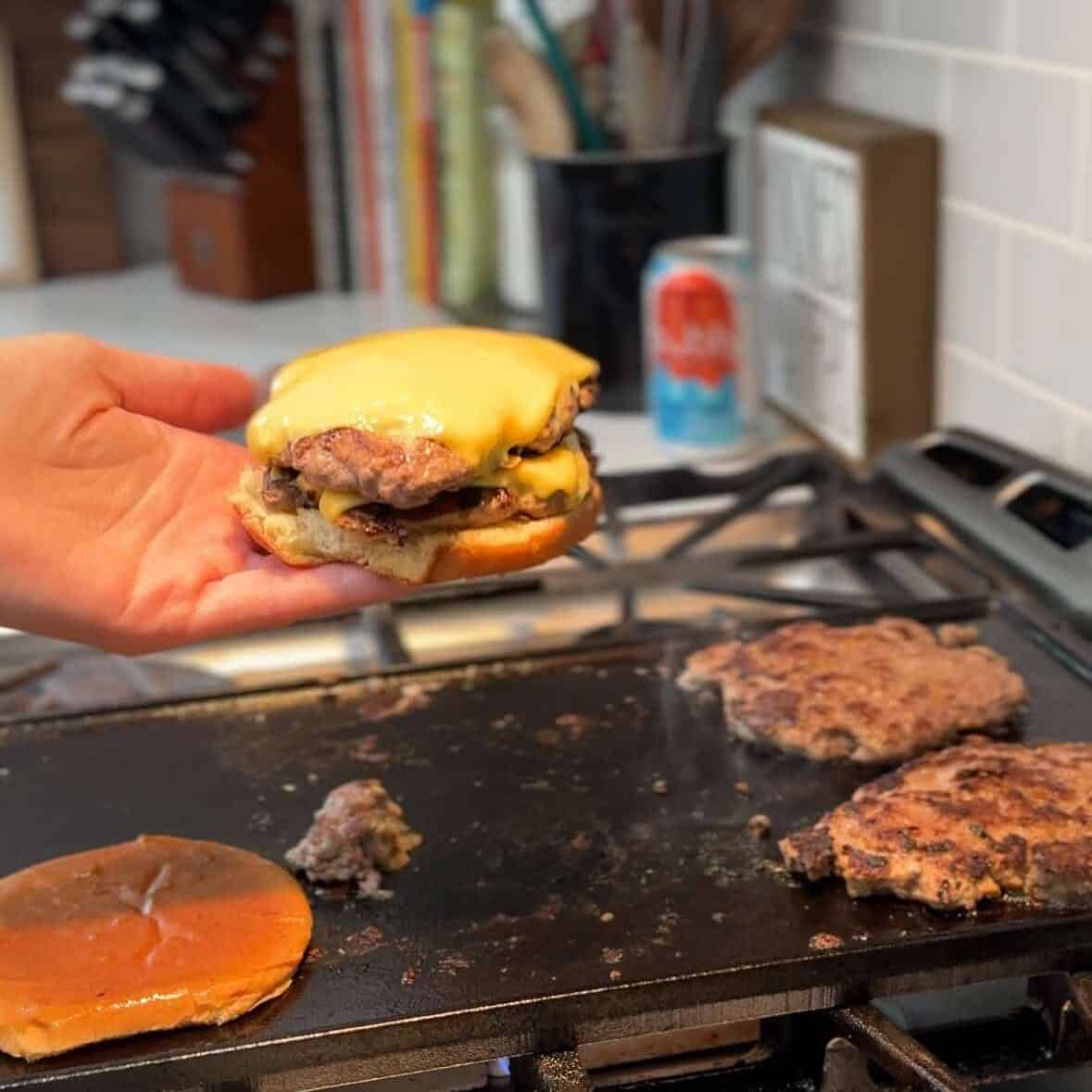 Double smash burger with melted cheese on a bun