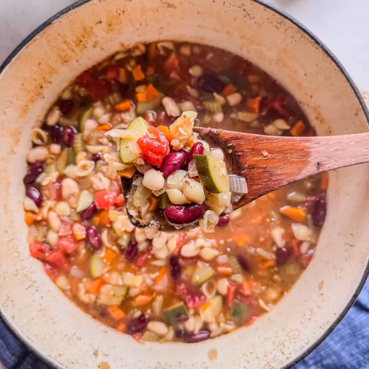 Cozy fall minestrone soup with pasta and beans, perfect for autumn dinners.