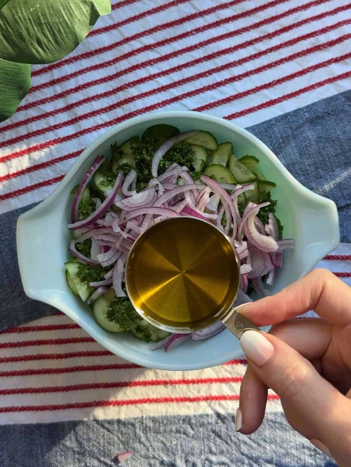 Olive oil, red wine vinegar, lemon juice, and sumac whisked together in a small bowl.