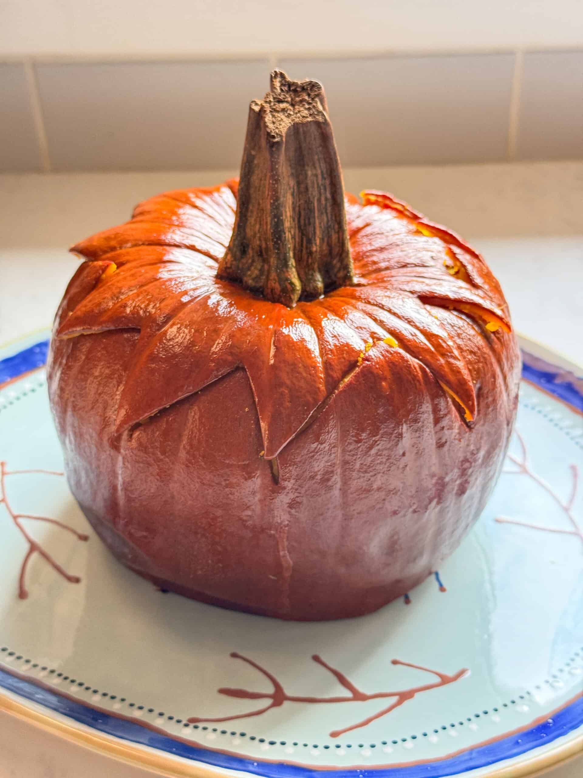 Close up of a baked Armenian stuffed pumpkin with its zigzag lid