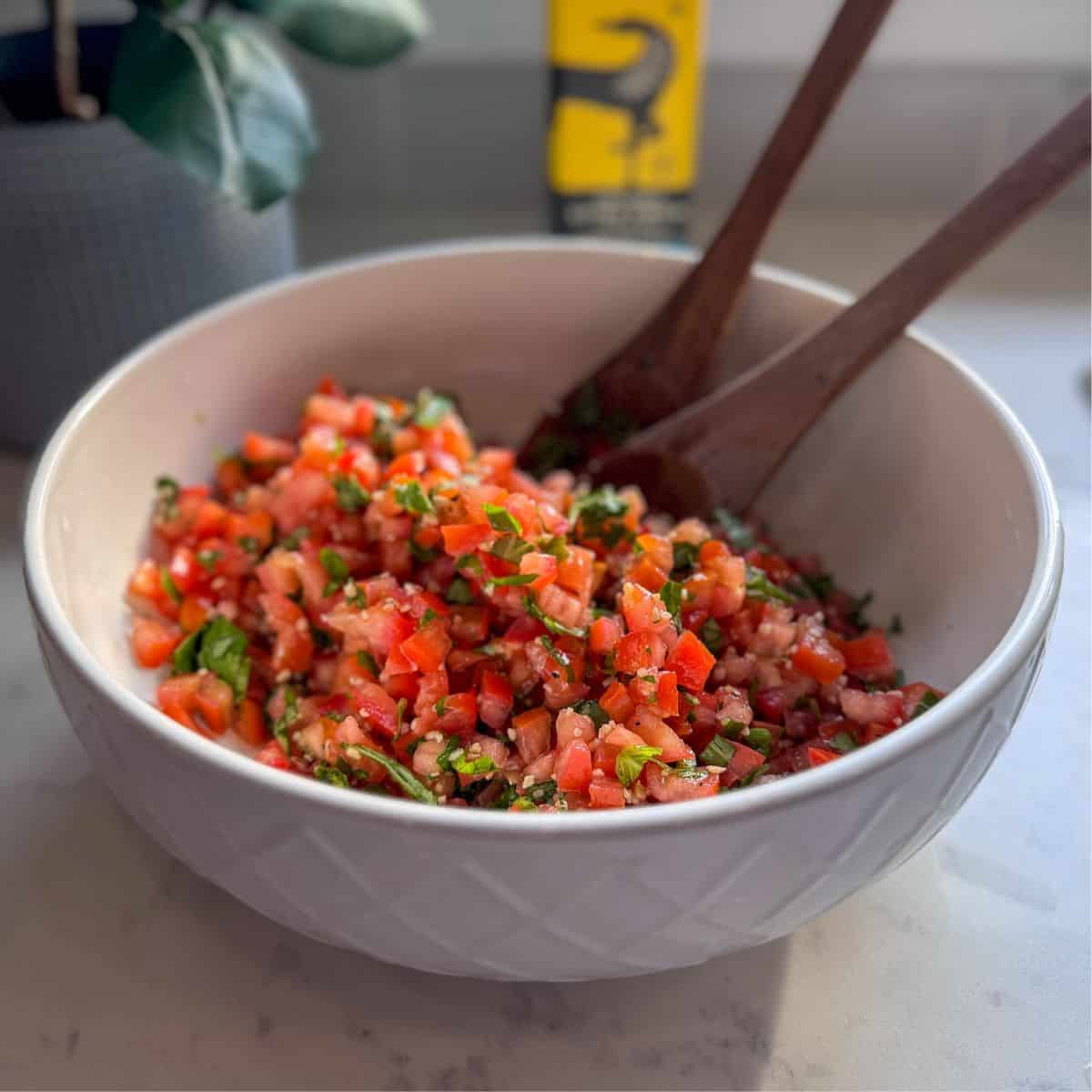 Bowl of tomato bruschetta mix served as a dip.