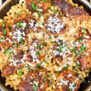 Close-up of creamy garlic parmesan chicken pasta with tender chicken, pasta, and freshly grated parmesan cheese