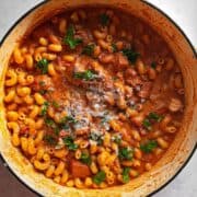 close up overhead creamy tomato chicken pasta showing creamy sauce and texture