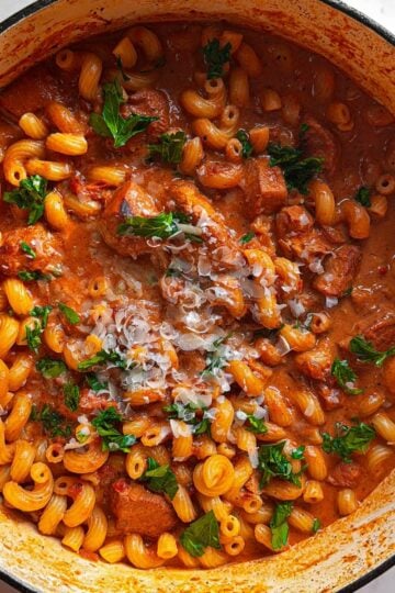 close up overhead creamy tomato chicken pasta showing creamy sauce and texture