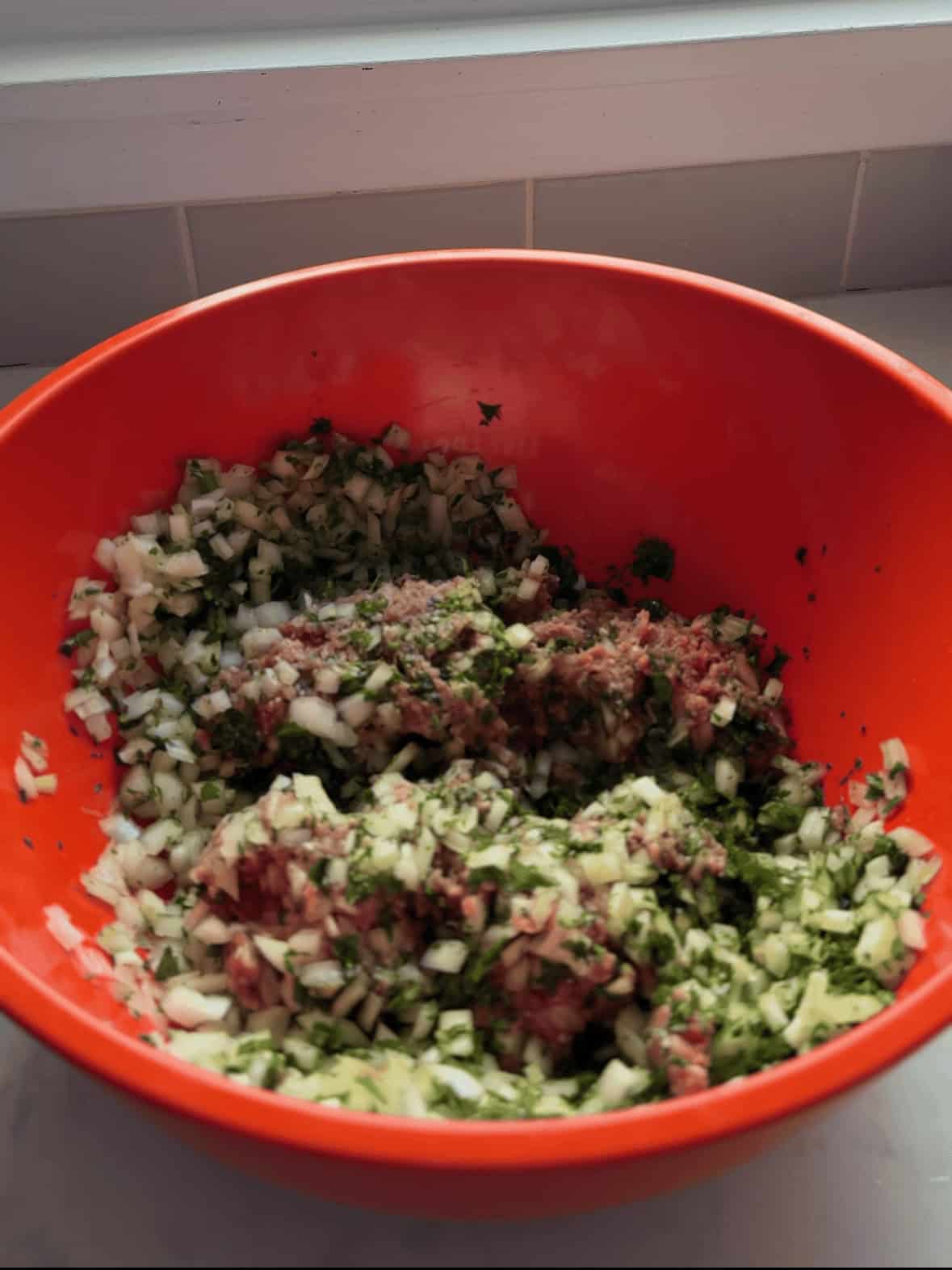 Ground sirloin, chopped onion, parsley, mint, salt, and pepper mixed together for Armenian Manti filling.