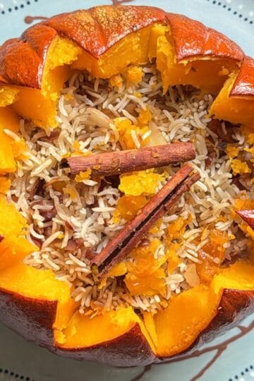 Steam rising from a freshly baked ghapama filled with rice and dried fruit